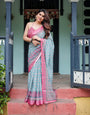 Aqua Blue Pure Cotton Linen Saree with Pink Border, Floral Motifs, and Tassel Detailing