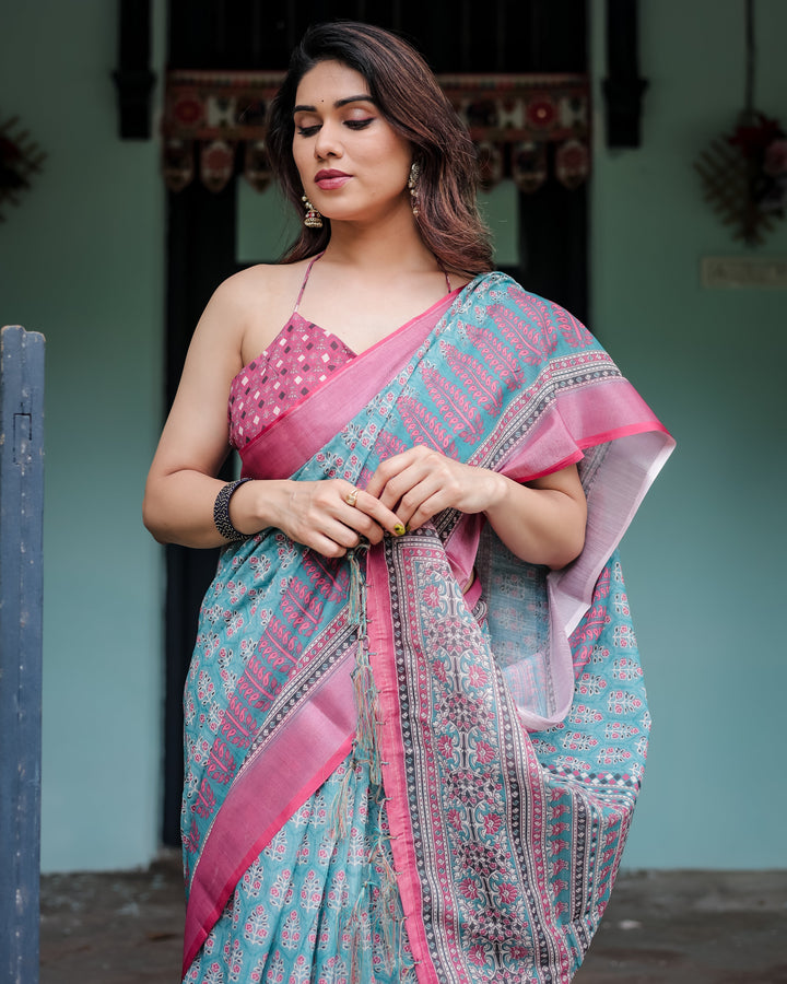 Aqua Blue Pure Cotton Linen Saree with Pink Border, Floral Motifs, and Tassel Detailing