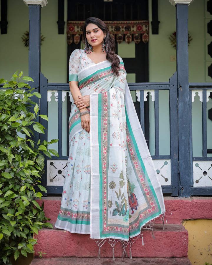 Ivory Pure Cotton Linen Saree with Elephant Motif and Floral Pattern, Green and Pink Borders, and Tassels on Edges.