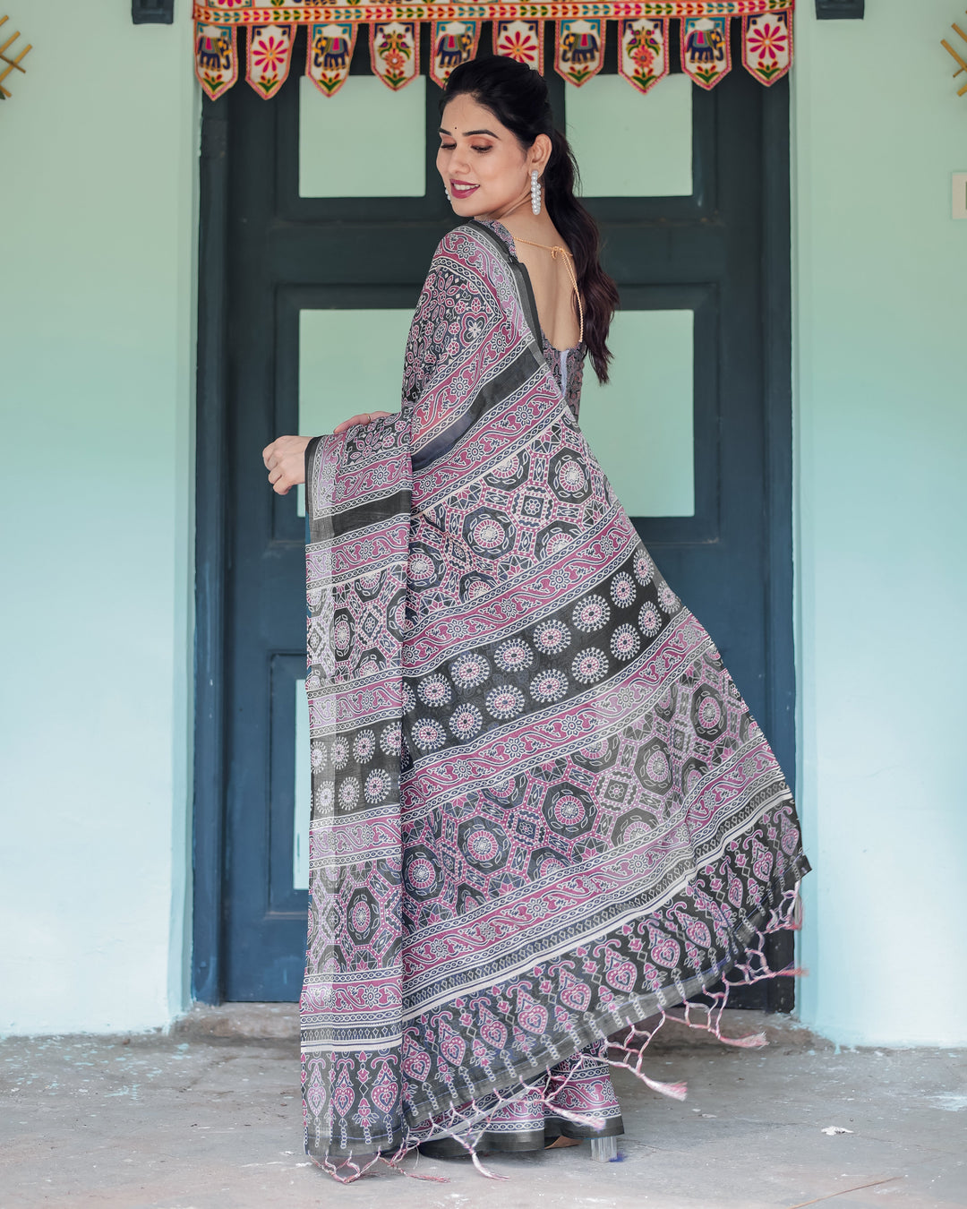 Black Pure Cotton Linen Saree with Pink Striped Pallu and Tassel Accents