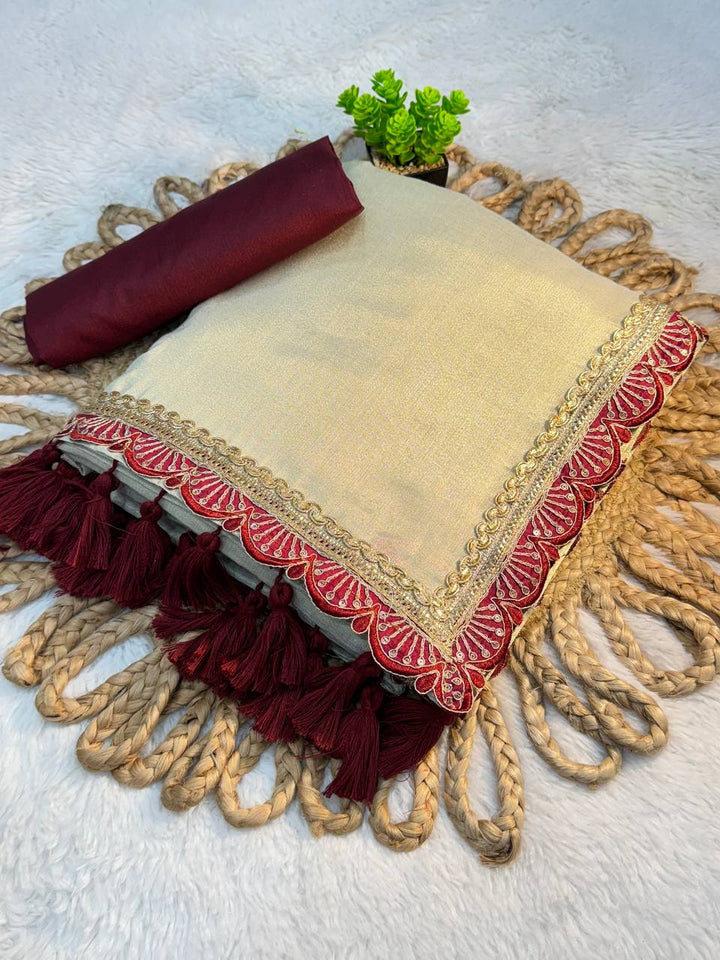 Ivory Tissue Soft Saree with Maroon Lace and Handmade Tassels