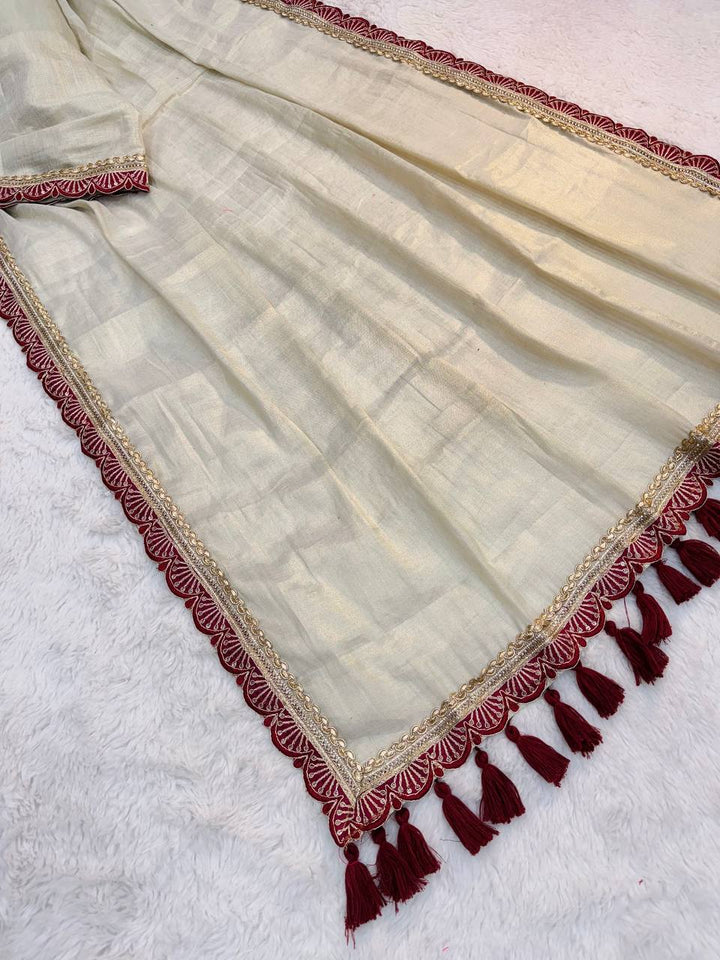 Ivory Tissue Soft Saree with Maroon Lace and Handmade Tassels