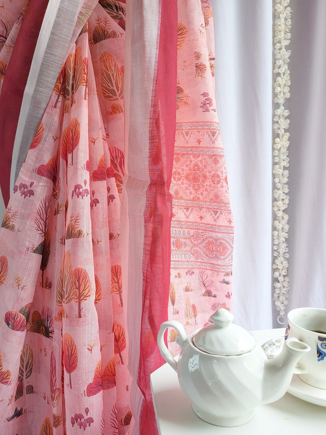 Blush Pink Handwoven Linen Saree with Vibrant Autumn Motifs & Tassel Detailing