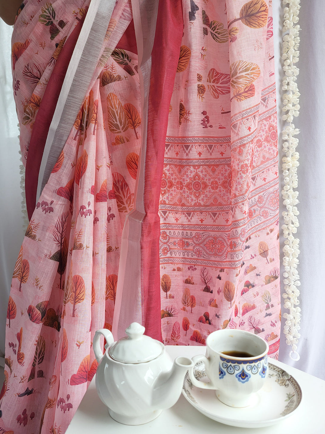 Blush Pink Handwoven Linen Saree with Vibrant Autumn Motifs & Tassel Detailing