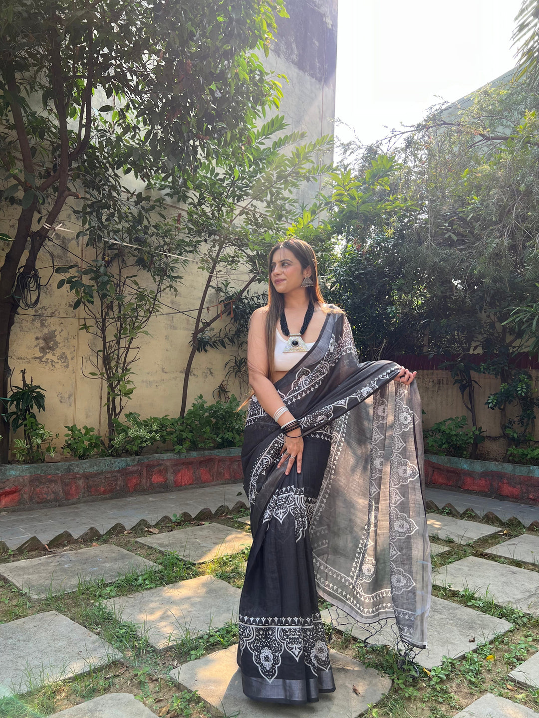 Black and White Pure Cotton Linen Saree with Intricate Floral Design and Tassels on Edges