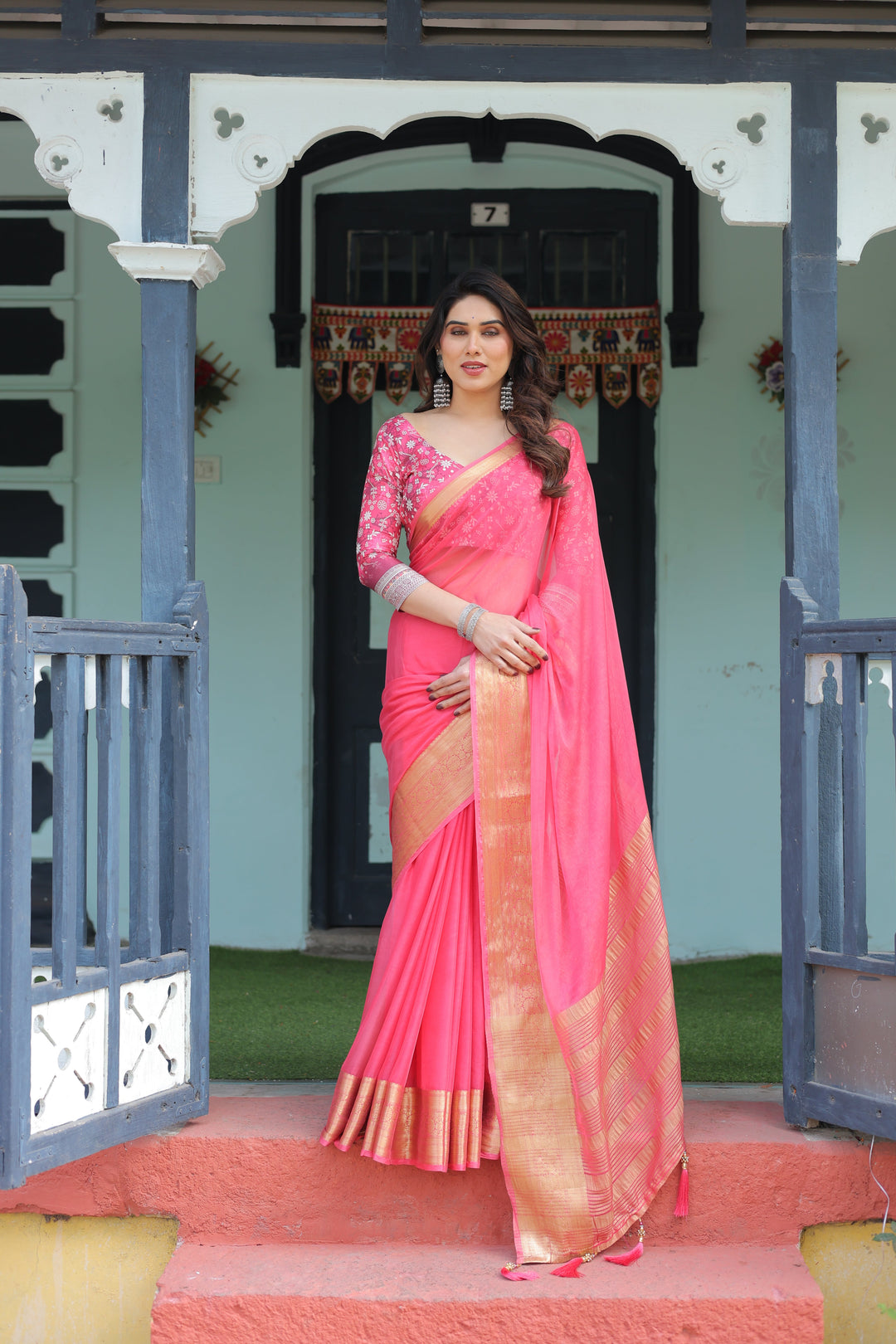 Ravishing Rani Pink Plain Chiffon Saree with Gold Zari Border, Floral Printed Blouse & Tassel Accents