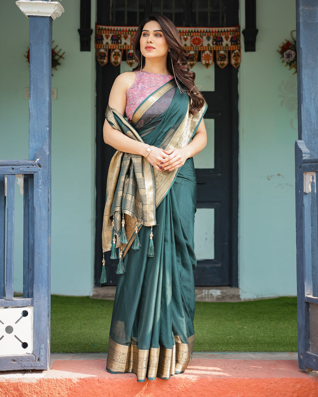 Enchanting Forest Green Plain Chiffon Saree with Gold Zari Border, Floral Printed Blouse & Tassel Details