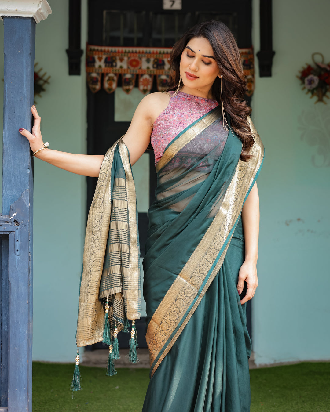 Enchanting Forest Green Plain Chiffon Saree with Gold Zari Border, Floral Printed Blouse & Tassel Details