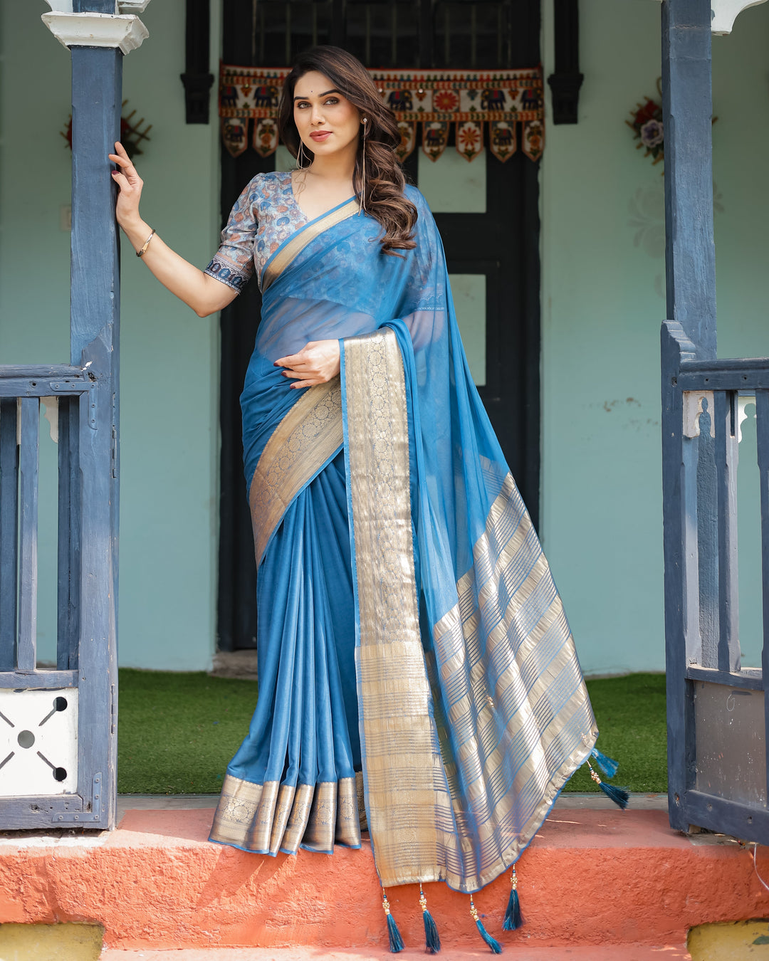 Vibrant Peacock Blue Plain Chiffon Saree with Gold Zari Border, Floral Printed Blouse & Tassel Accents