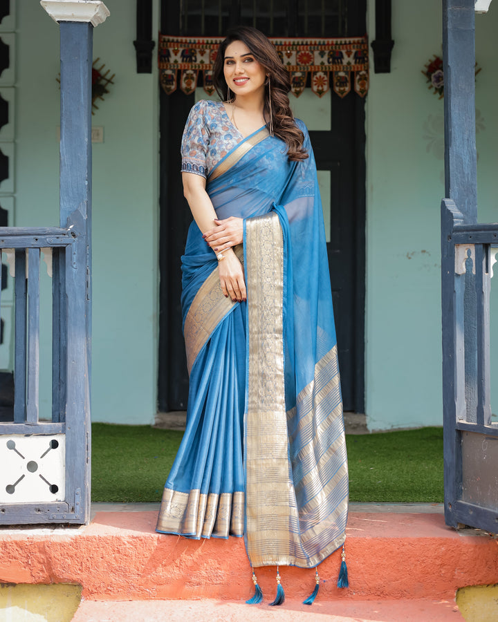 Vibrant Peacock Blue Plain Chiffon Saree with Gold Zari Border, Floral Printed Blouse & Tassel Accents