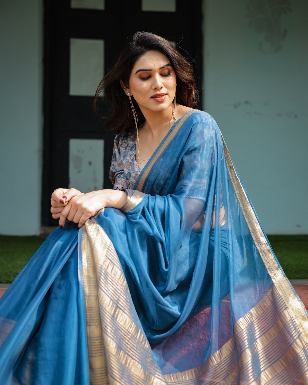 Vibrant Peacock Blue Plain Chiffon Saree with Gold Zari Border, Floral Printed Blouse & Tassel Accents