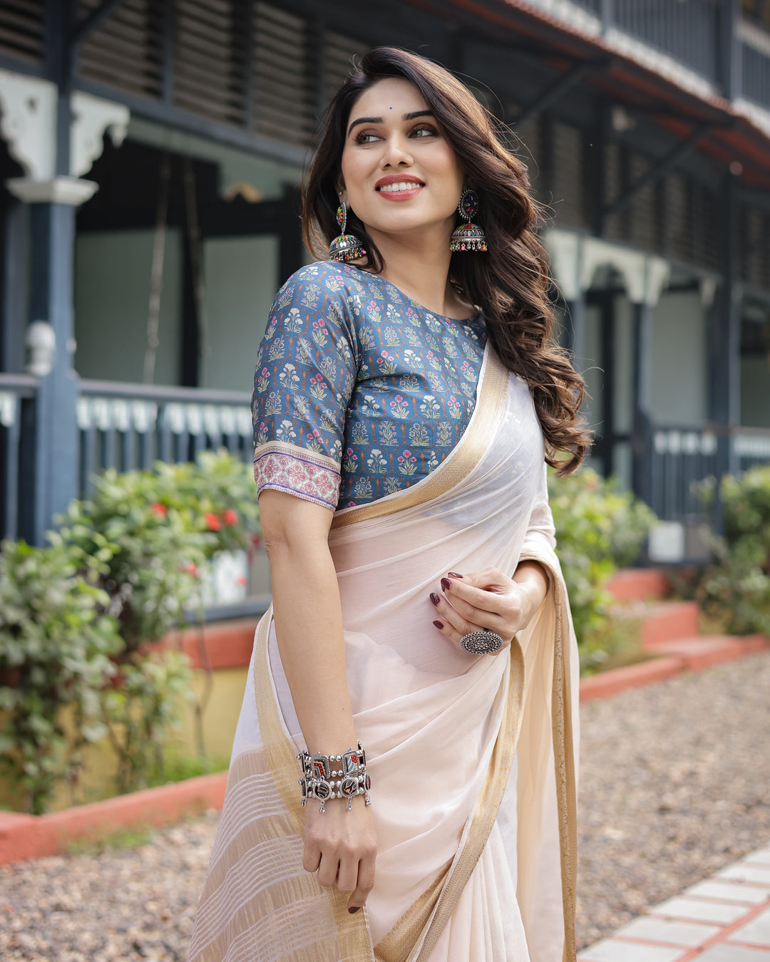 Ivory White Plain Chiffon Saree with Gold Zari Border, Floral Printed Blouse & Tassel Detailing