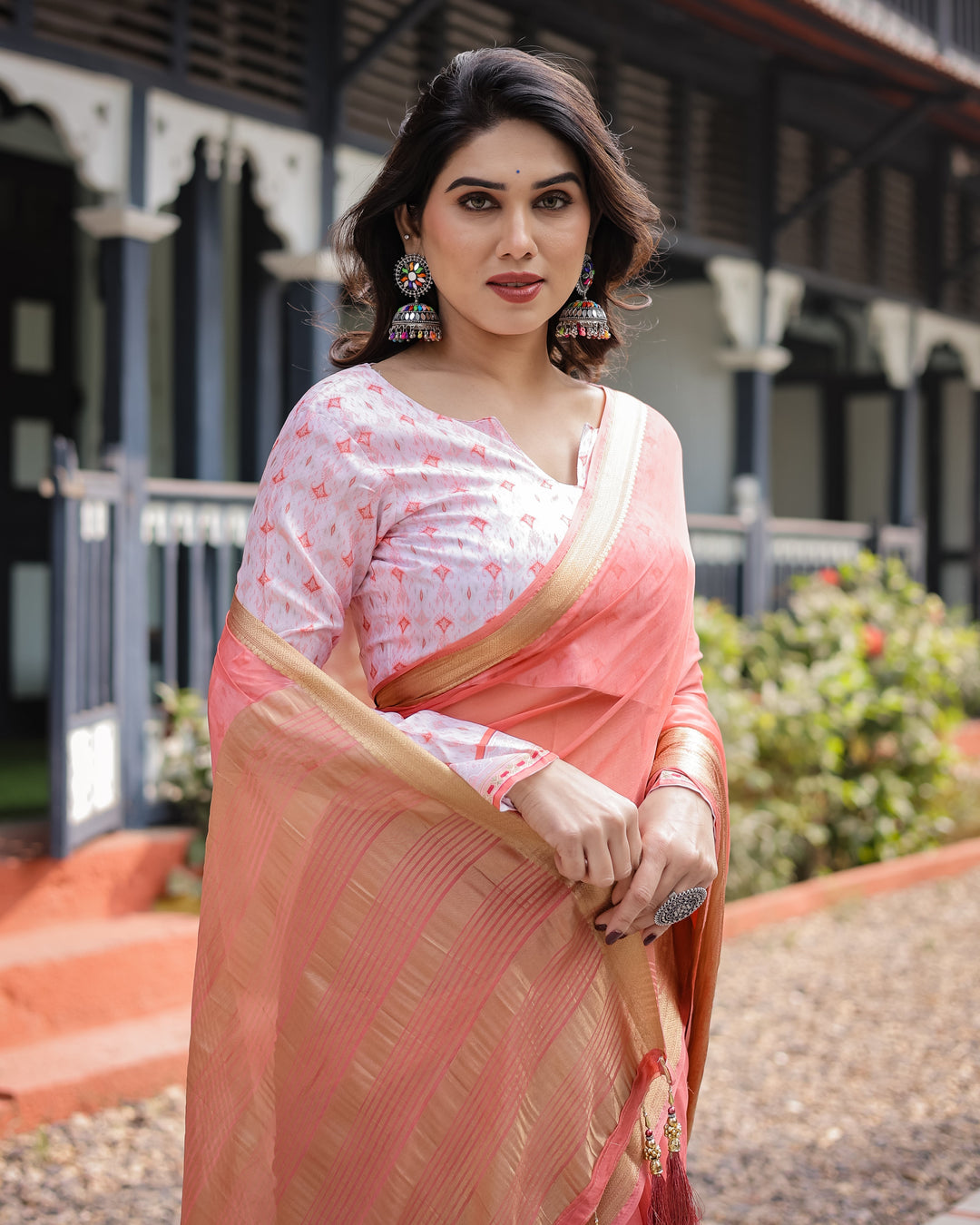 Peach Pink Plain Chiffon Saree with Gold Zari Border, Geometric Printed Blouse & Tassel Detailing