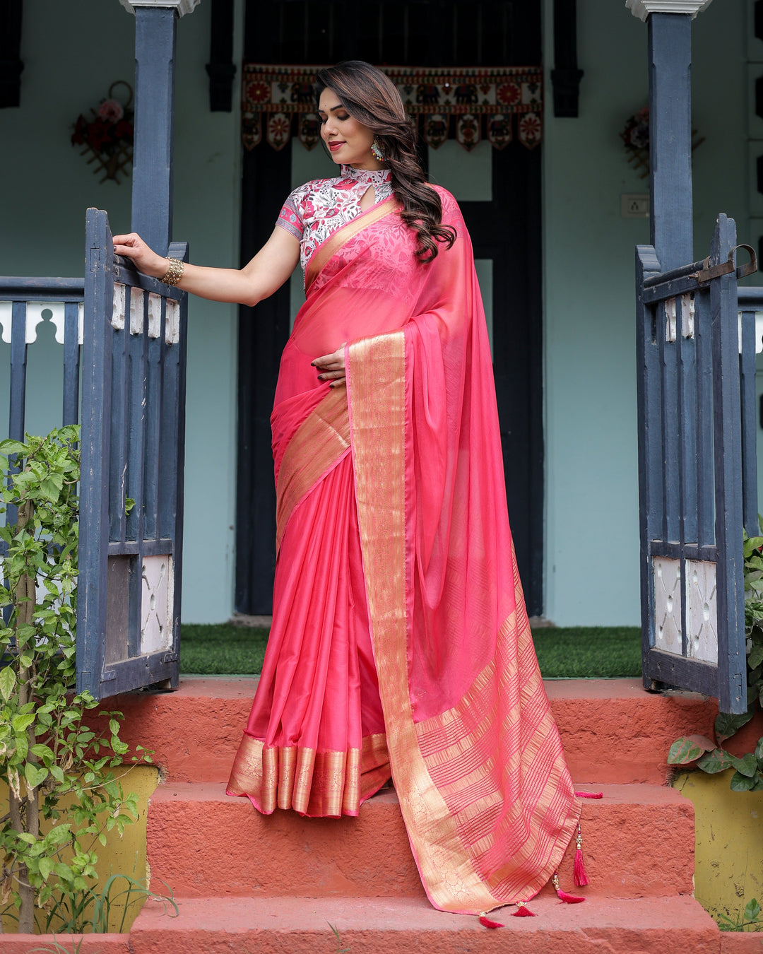 Raspberry Pink Plain Chiffon Saree with Gold Zari Border, High-Neck Floral Printed Blouse & Tassel Detailing