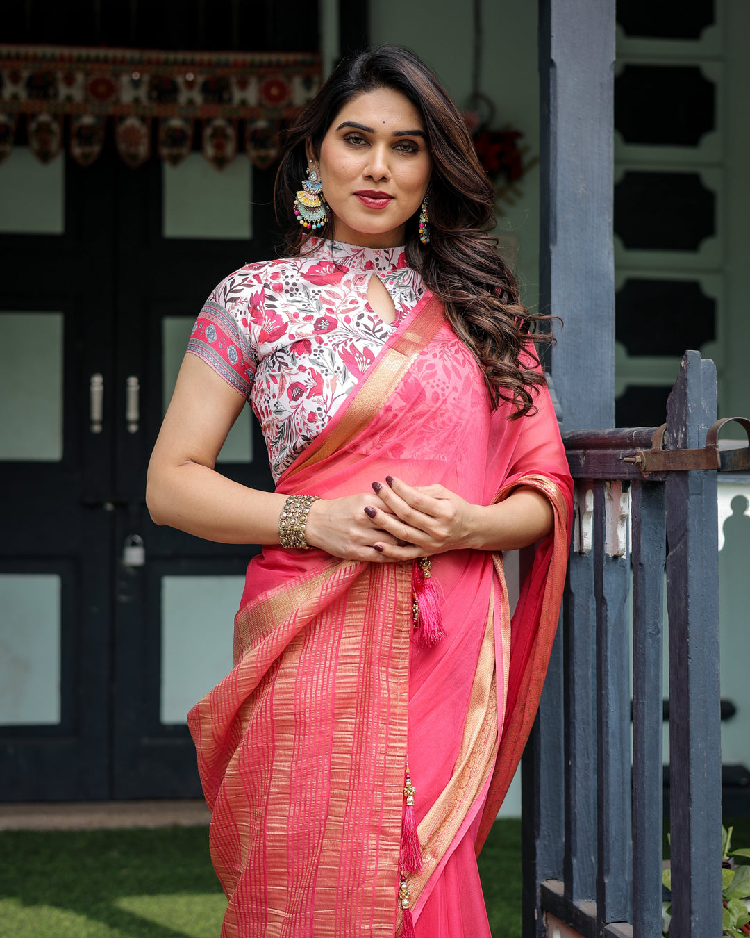 Raspberry Pink Plain Chiffon Saree with Gold Zari Border, High-Neck Floral Printed Blouse & Tassel Detailing