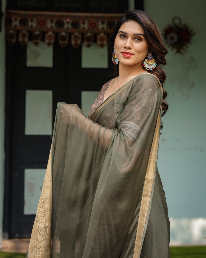 Elegant Olive Green Plain Chiffon Saree with Gold Zari Border, Floral Printed Blouse & Tassel Detailing