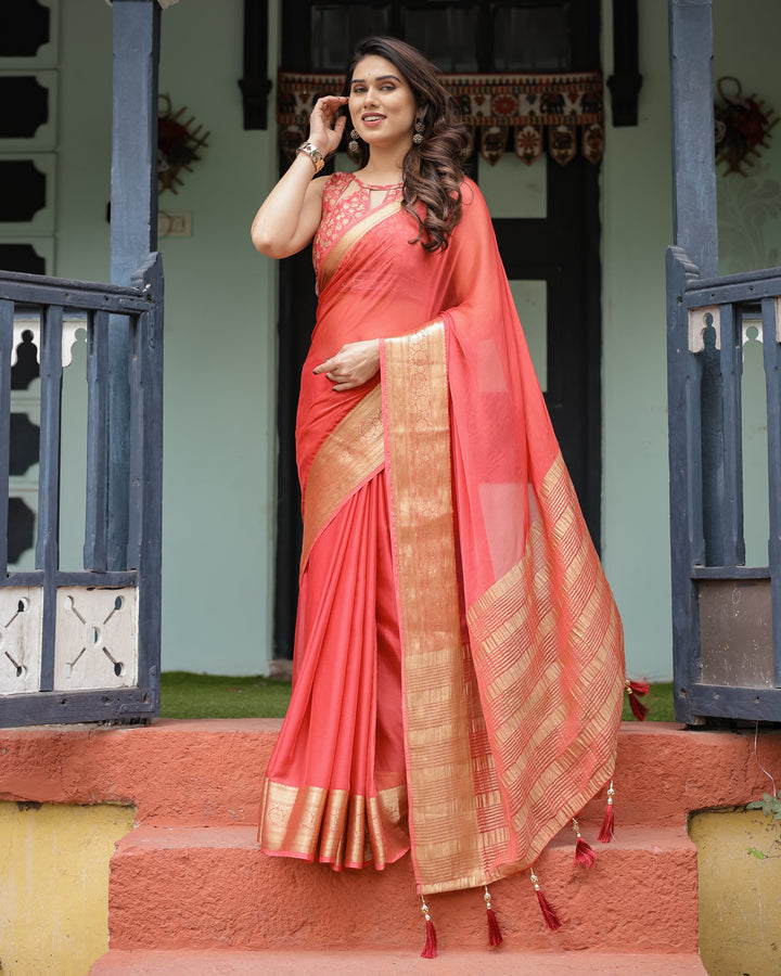 Graceful Coral Pink Plain Chiffon Saree with Gold Zari Border, Floral Embroidered Blouse & Tassel Detailing