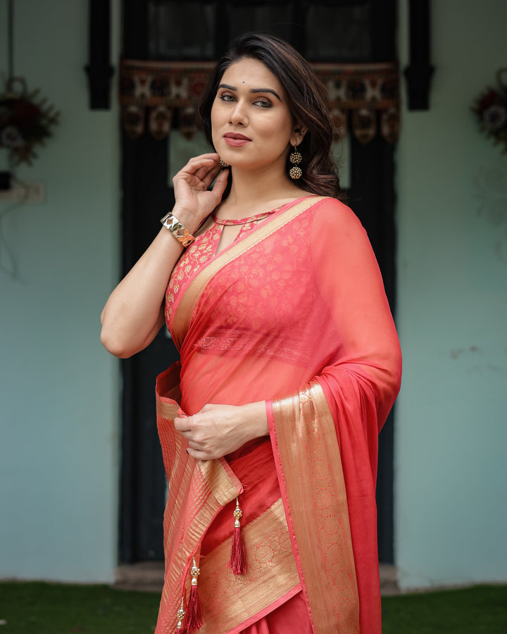 Graceful Coral Pink Plain Chiffon Saree with Gold Zari Border, Floral Embroidered Blouse & Tassel Detailing