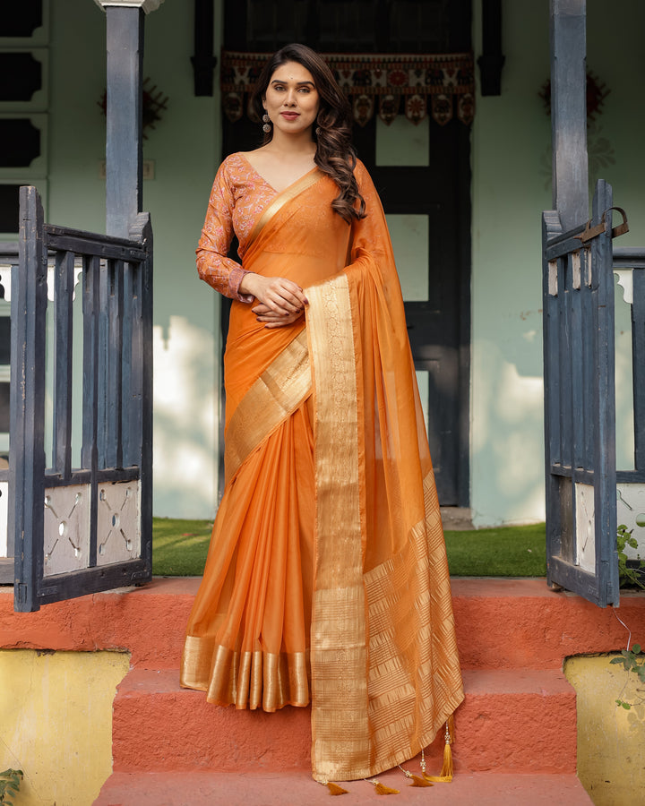 Sunset Orange Plain Chiffon Saree with Gold Zari Border, Floral Embroidered Blouse & Tassel Detailing