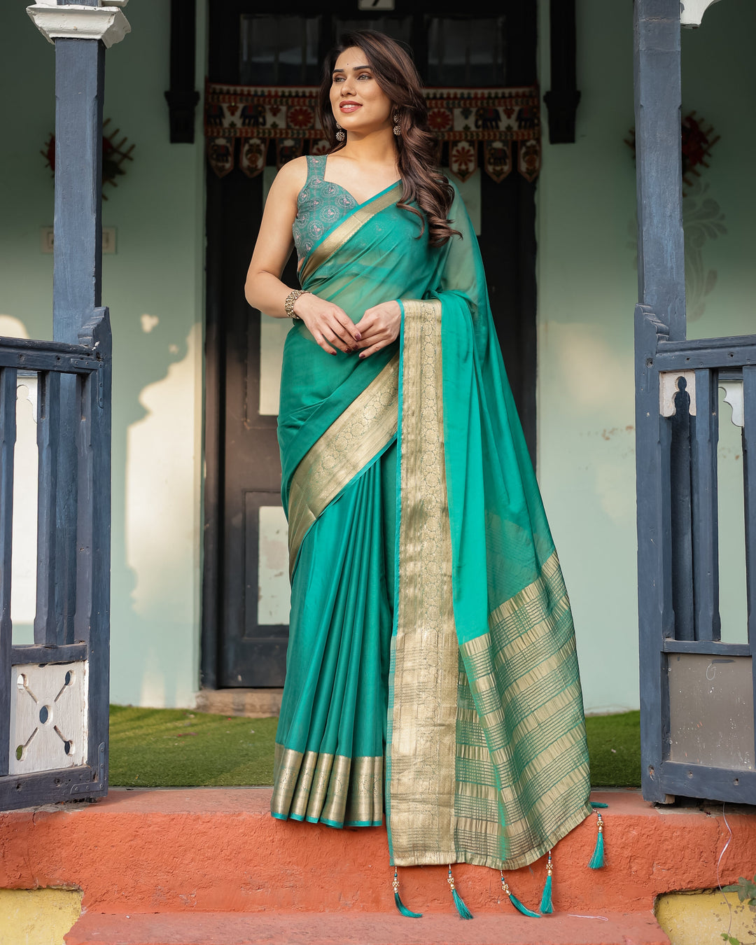 Elegant Sea Green Plain Chiffon Saree with Gold Zari Border, Paisley Printed Blouse & Tassel Detailing