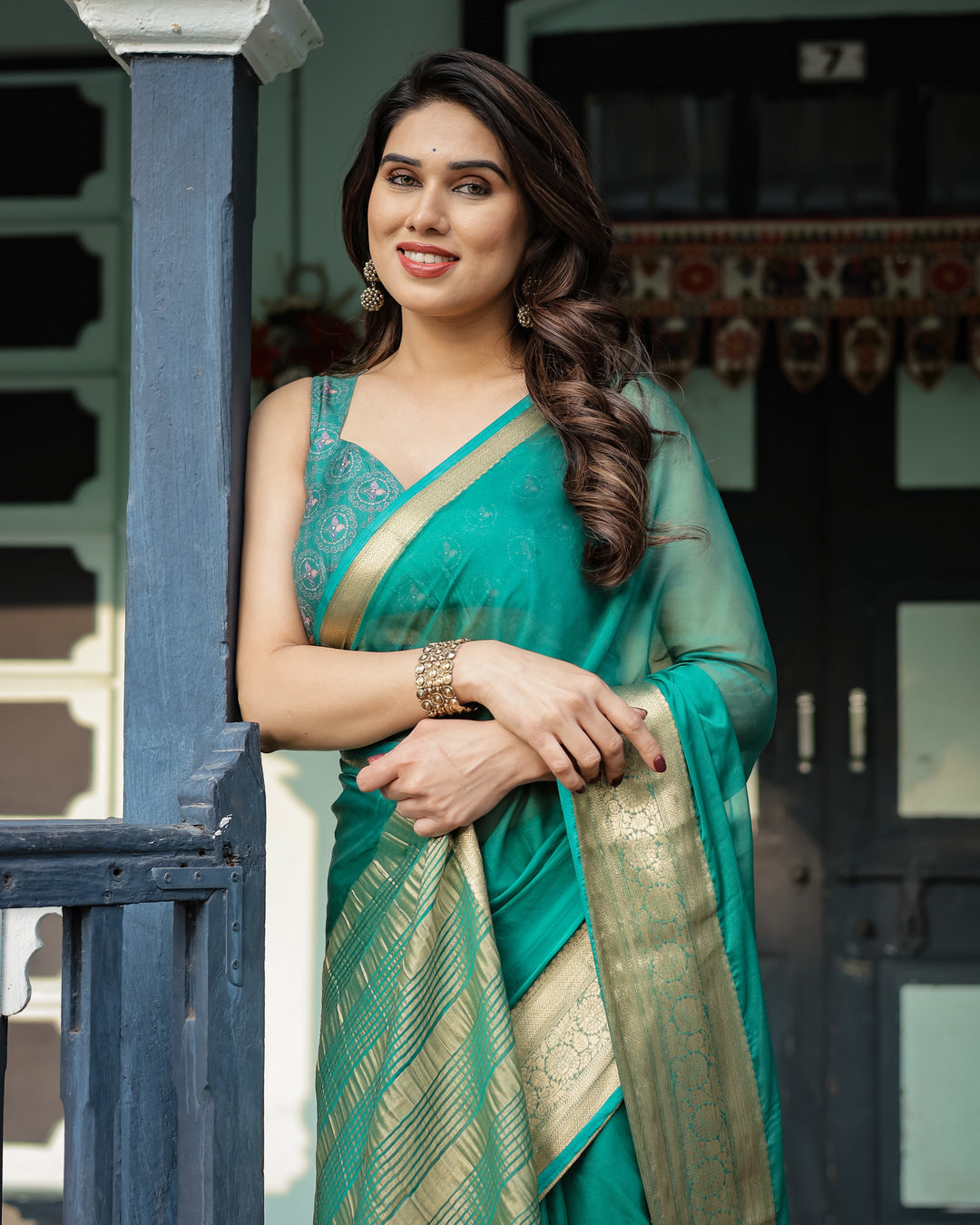 Elegant Sea Green Plain Chiffon Saree with Gold Zari Border, Paisley Printed Blouse & Tassel Detailing