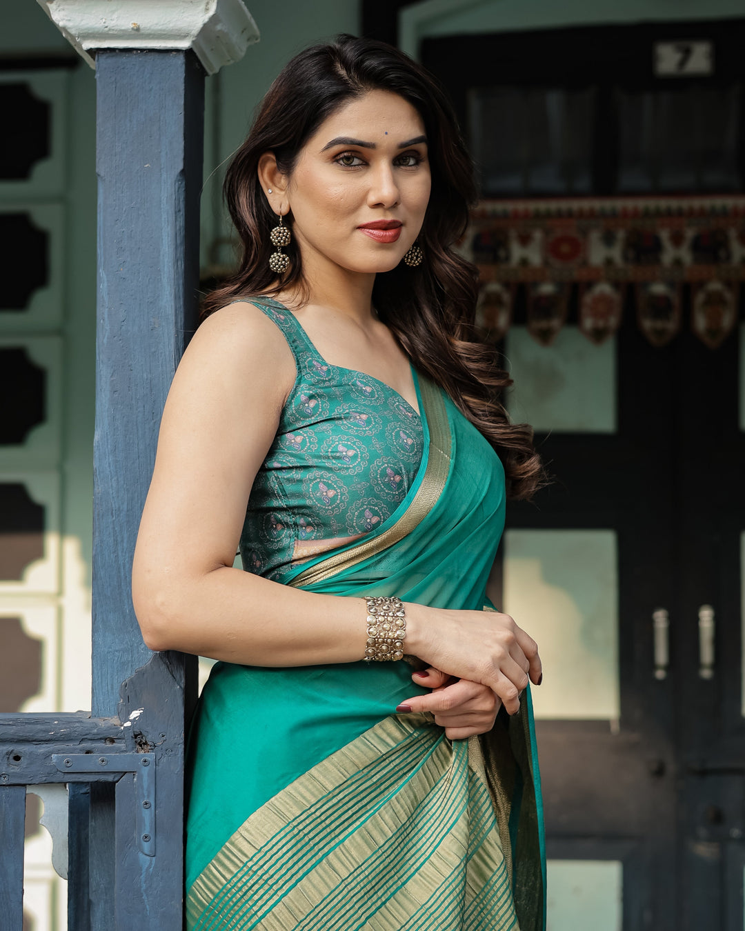 Elegant Sea Green Plain Chiffon Saree with Gold Zari Border, Paisley Printed Blouse & Tassel Detailing