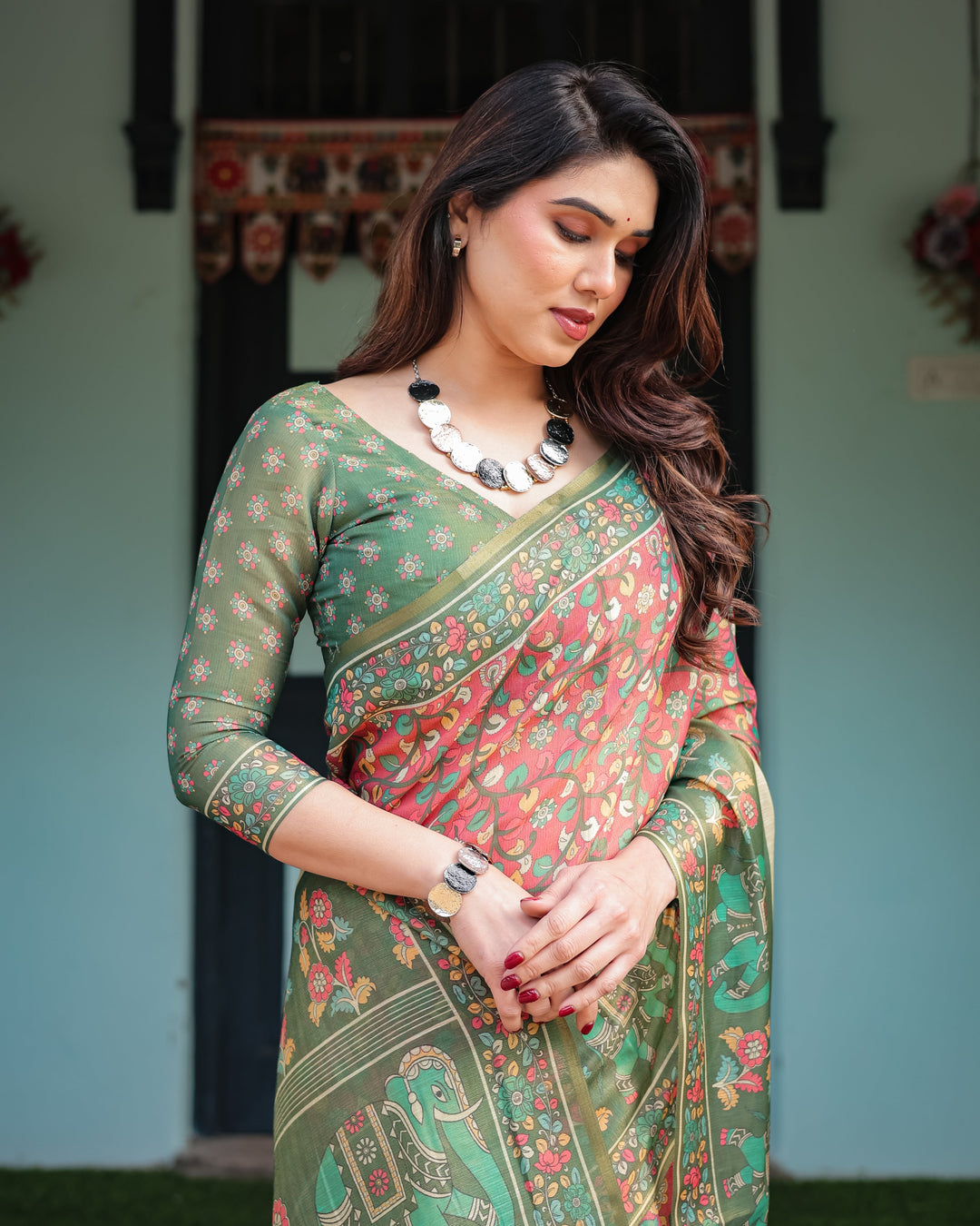 Green and Red Handloom Cotton-Linen Saree with Elephant Motifs and Floral Detailing