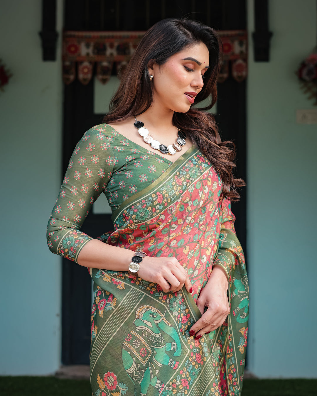 Green and Red Handloom Cotton-Linen Saree with Elephant Motifs and Floral Detailing