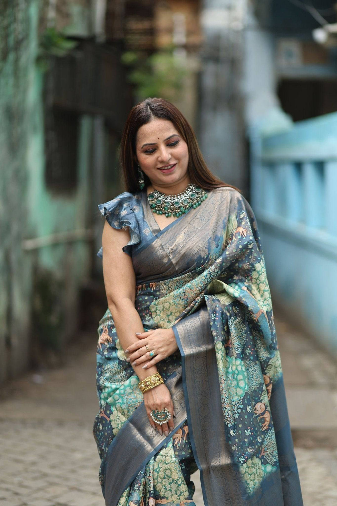 Elegant Teal Blue Banarasi Silk Saree with Forest-Inspired Motifs and Tassels