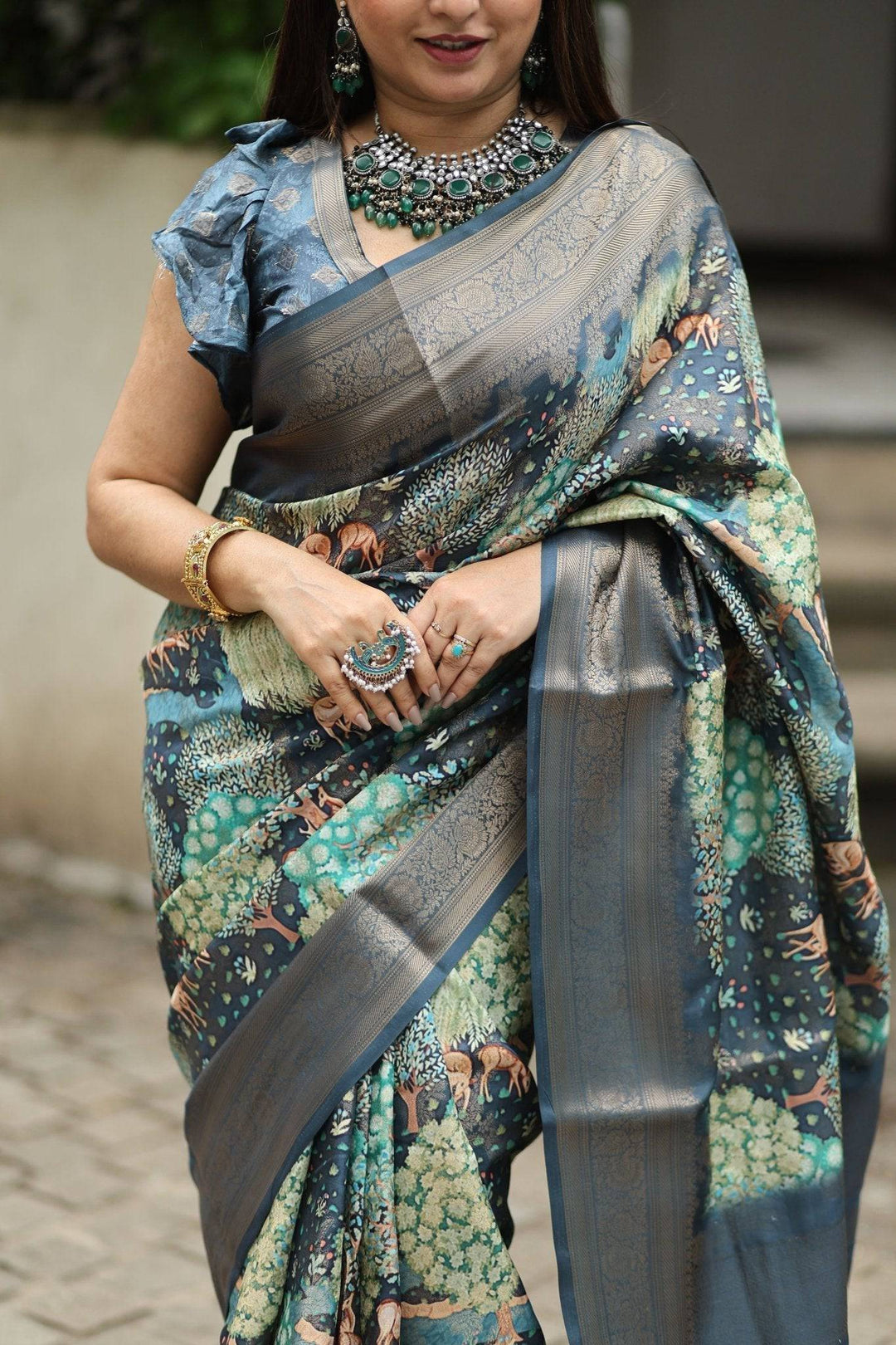 Elegant Teal Blue Banarasi Silk Saree with Forest-Inspired Motifs and Tassels