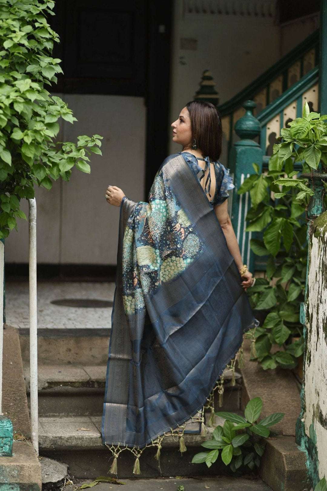 Elegant Teal Blue Banarasi Silk Saree with Forest-Inspired Motifs and Tassels