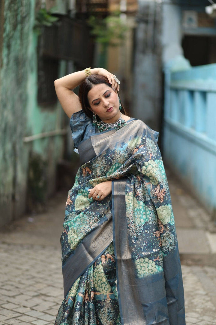 Elegant Teal Blue Banarasi Silk Saree with Forest-Inspired Motifs and Tassels