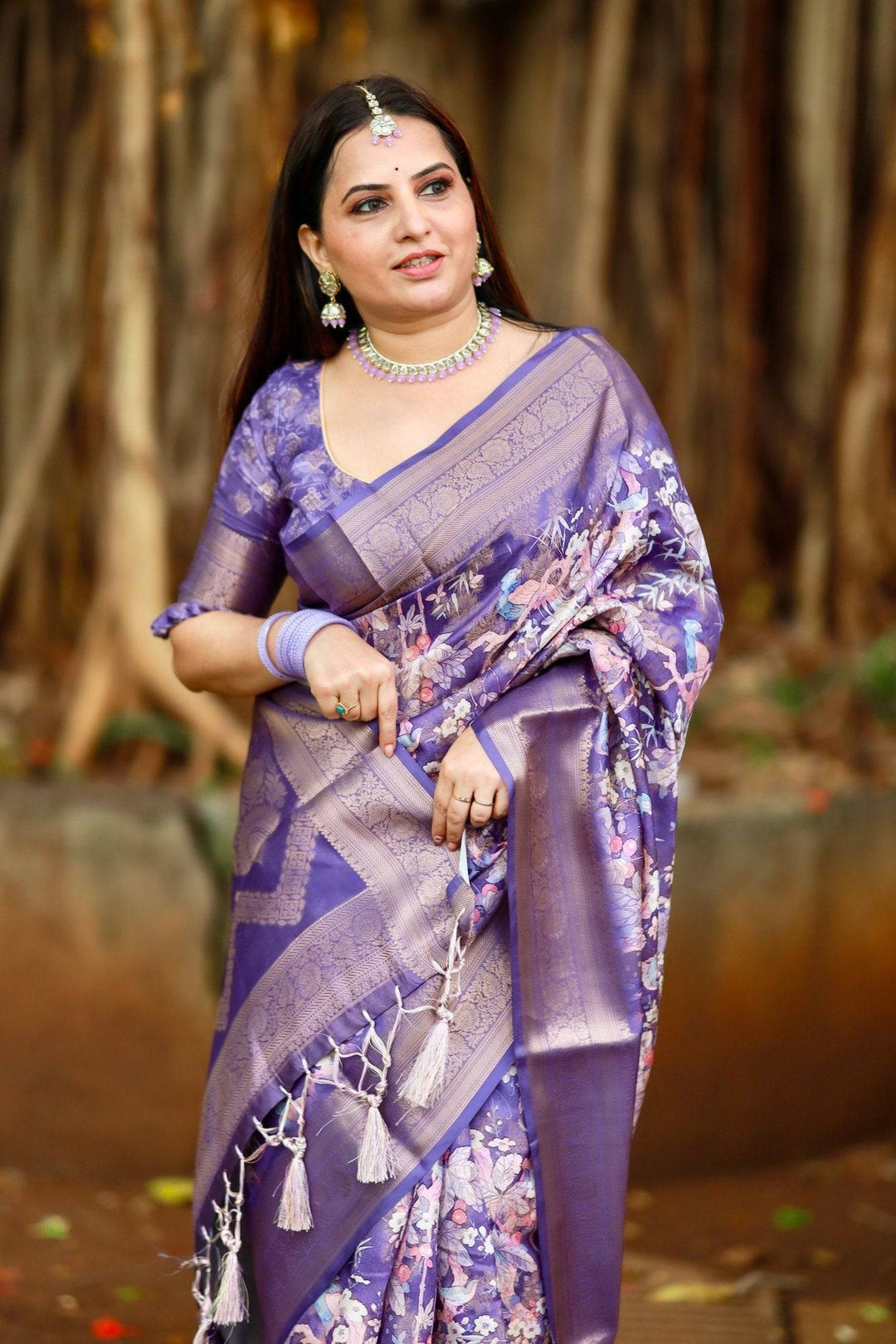 Regal Purple Banarasi Silk Saree with Floral Motifs and Elegant Tassels