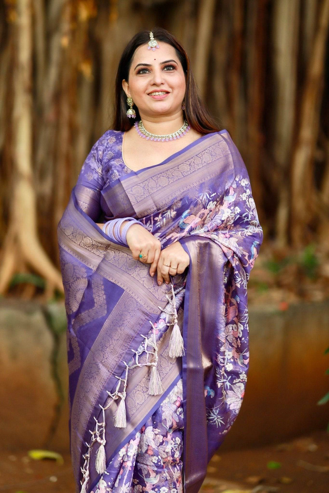 Regal Purple Banarasi Silk Saree with Floral Motifs and Elegant Tassels