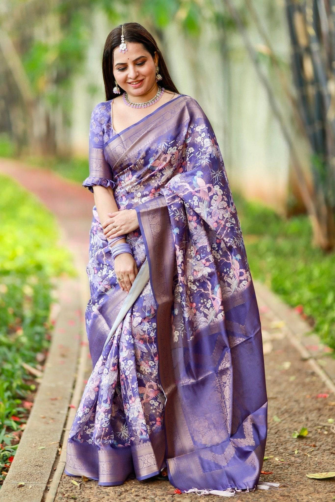 Regal Purple Banarasi Silk Saree with Floral Motifs and Elegant Tassels