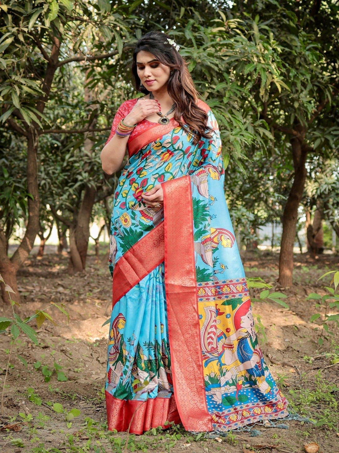 Aqua Blue Tussar Silk Saree with Vibrant Nature-Inspired Prints and Red Zari Border