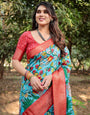 Aqua Blue Tussar Silk Saree with Vibrant Nature-Inspired Prints and Red Zari Border