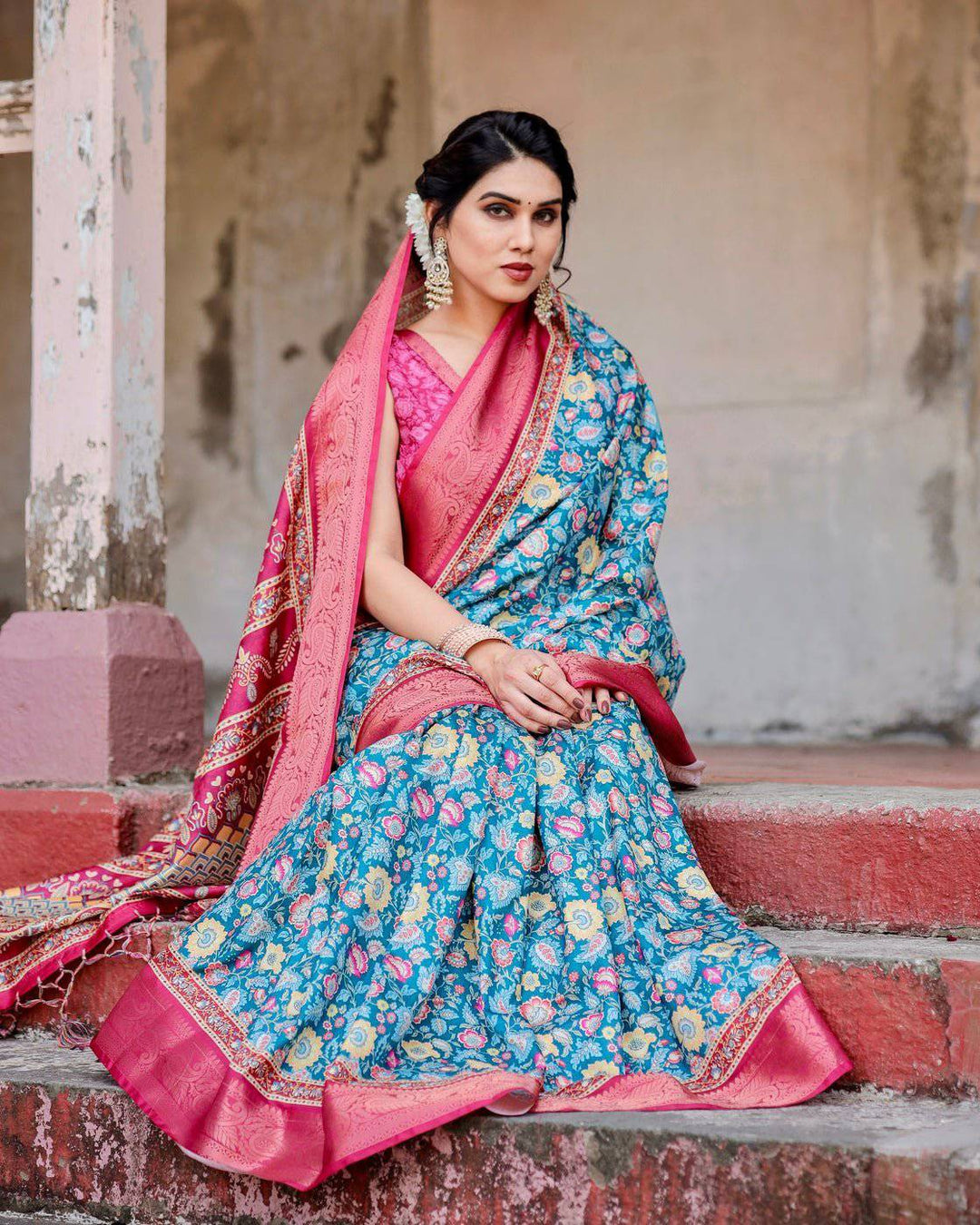 Teal Blue and Coral Tussar Silk Saree with Vibrant Floral Motifs and Ornamental Pallu