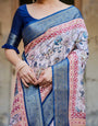 Ivory and Navy Blue Tussar Silk Saree with Floral Elegance and Ornamental Zari Work