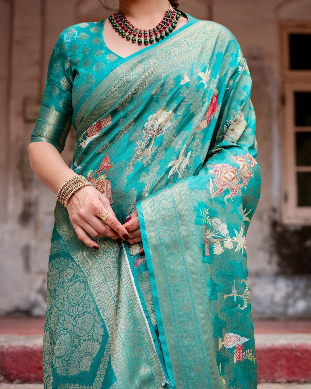 Elegant Teal Green Banarasi Silk Saree with Intricate Zari Weaving and Tassels