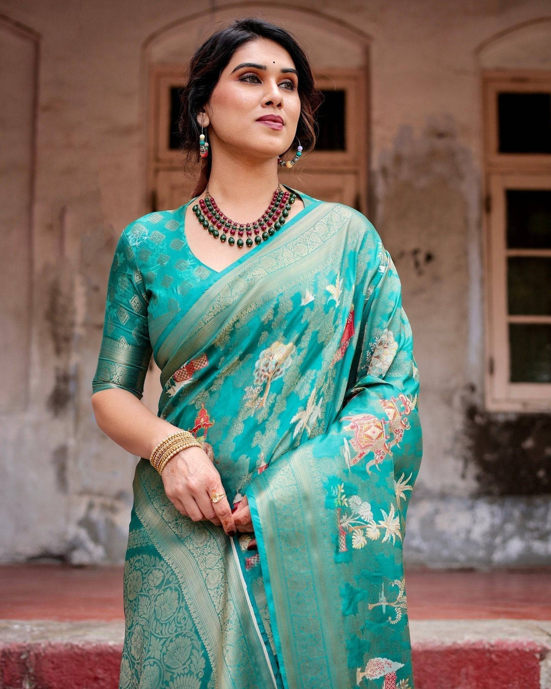 Elegant Teal Green Banarasi Silk Saree with Intricate Zari Weaving and Tassels