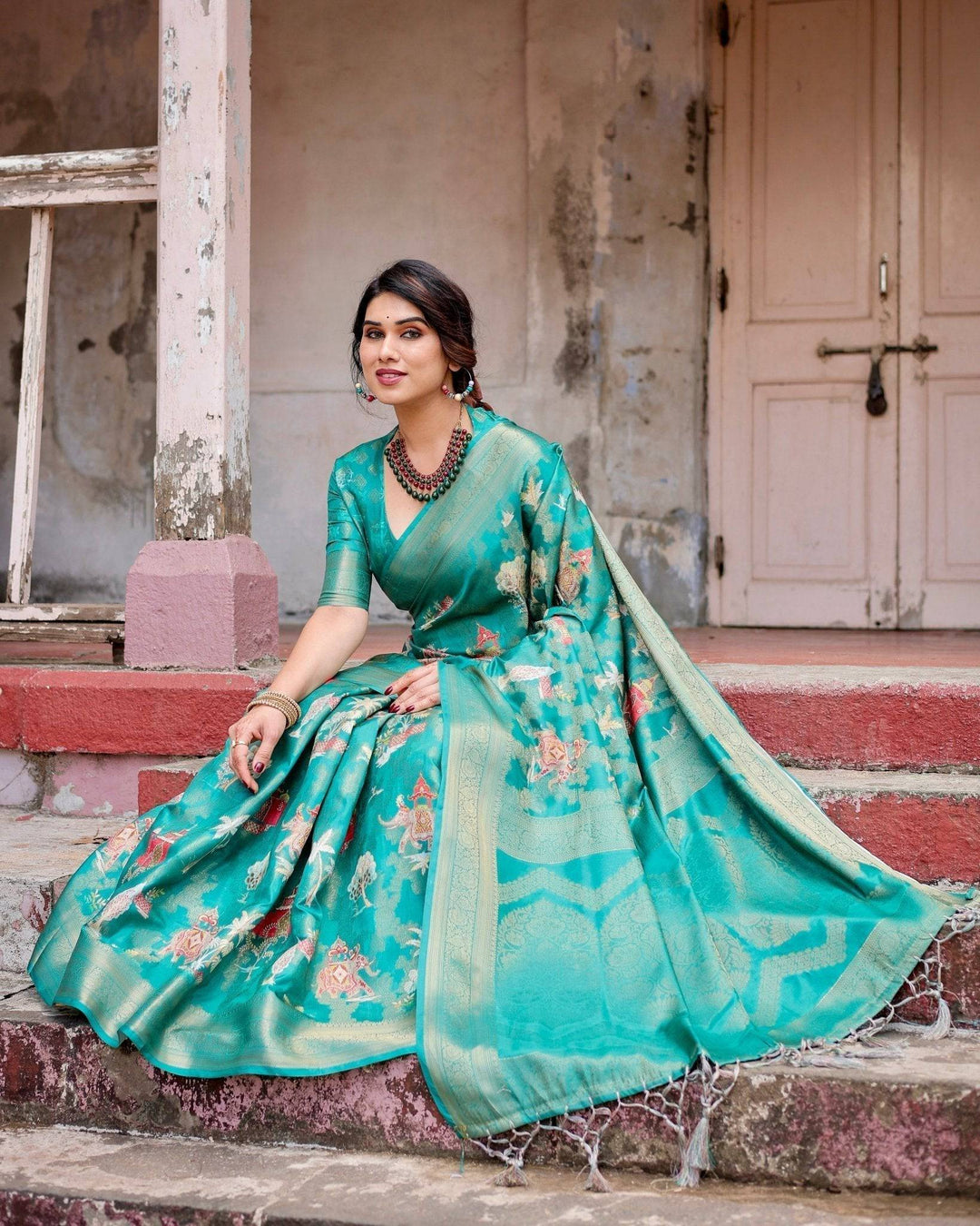 Elegant Teal Green Banarasi Silk Saree with Intricate Zari Weaving and Tassels