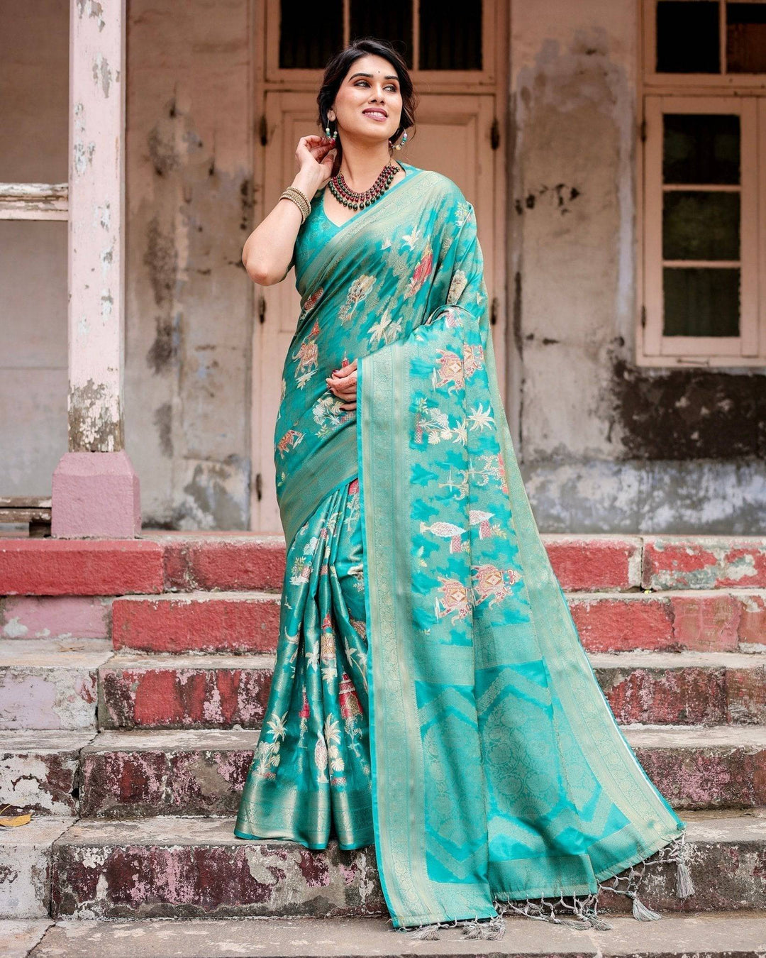 Elegant Teal Green Banarasi Silk Saree with Intricate Zari Weaving and Tassels