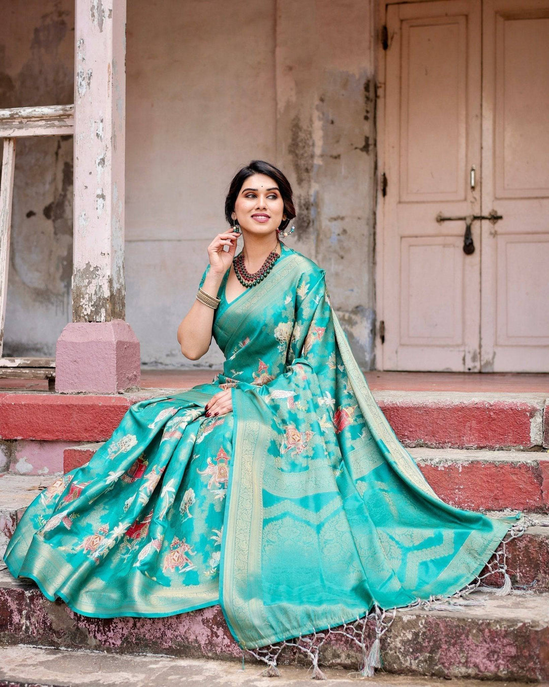 Elegant Teal Green Banarasi Silk Saree with Intricate Zari Weaving and Tassels