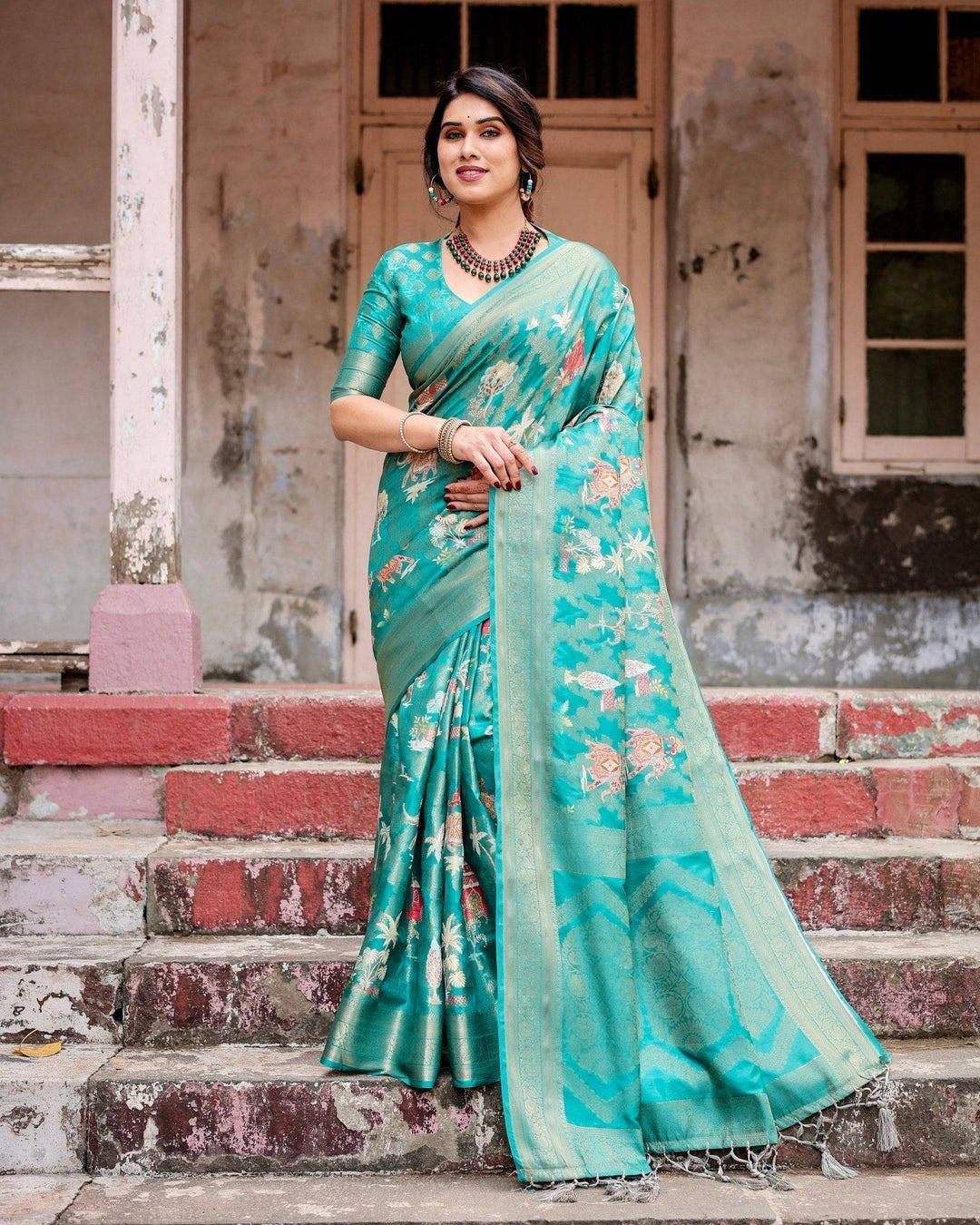 Elegant Teal Green Banarasi Silk Saree with Intricate Zari Weaving and Tassels