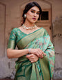 Graceful Green Banarasi Silk Saree with Intricate Floral and Elephant Weaves