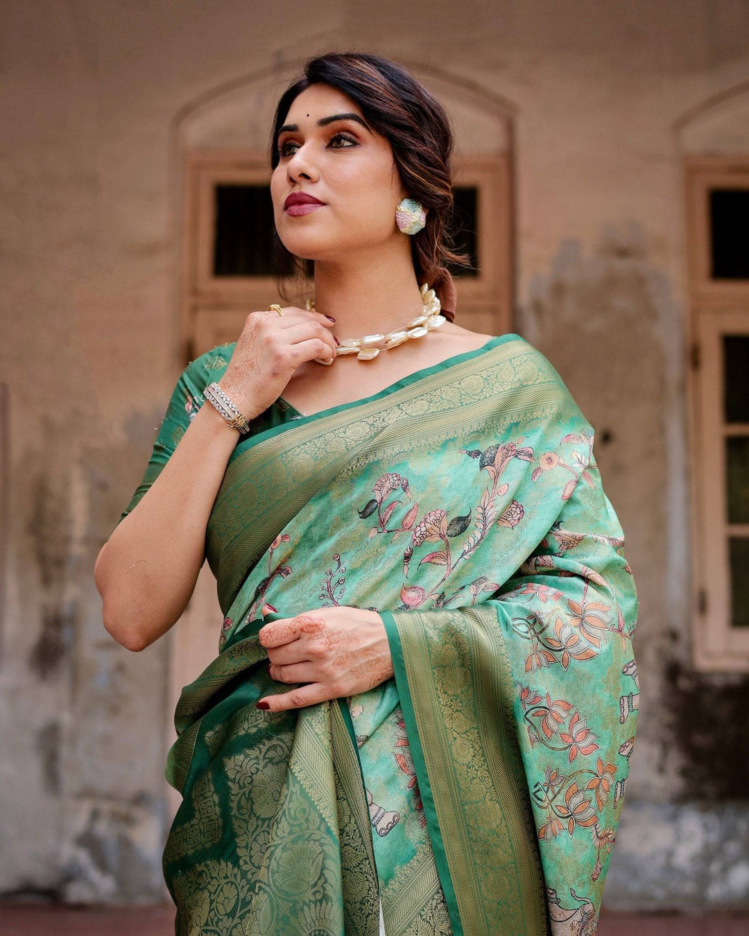 Graceful Green Banarasi Silk Saree with Intricate Floral and Elephant Weaves