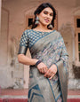 Elegant Blue and Grey Banarasi Silk Saree with Intricate Floral Patterns, Zari Woven Borders, and Tassel Accents