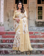 Ivory and Gold Banarasi Silk Saree with Floral Print, Zari Border, and Tassels