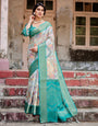 Graceful Green Banarasi Silk Saree with Vibrant Motifs and Zari Woven Pallu